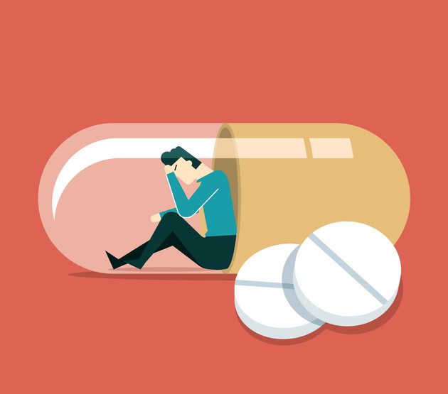 Graphic of a patient man in depression drowning in medications sitting inside a bottle